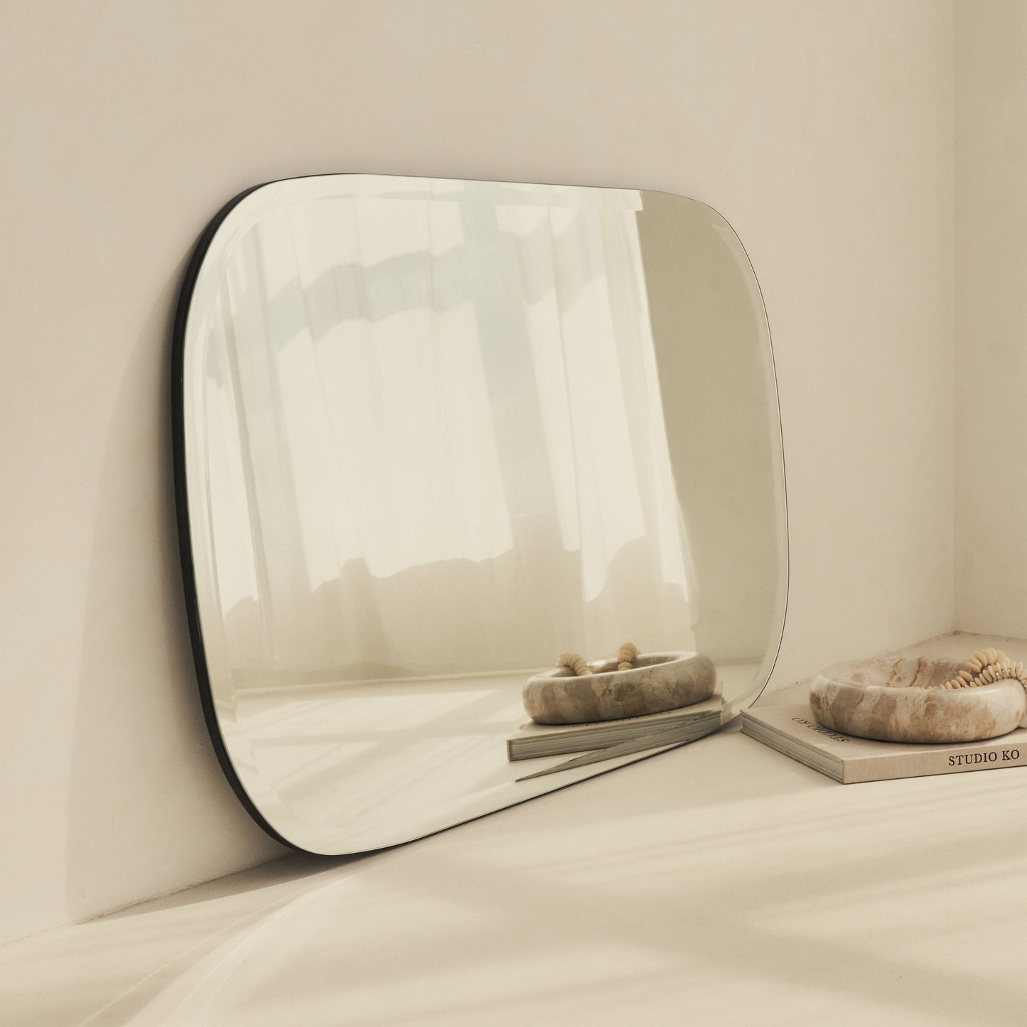 Vienna - Large Frameless Curved Bevelled Mirror 100cm x 65cm