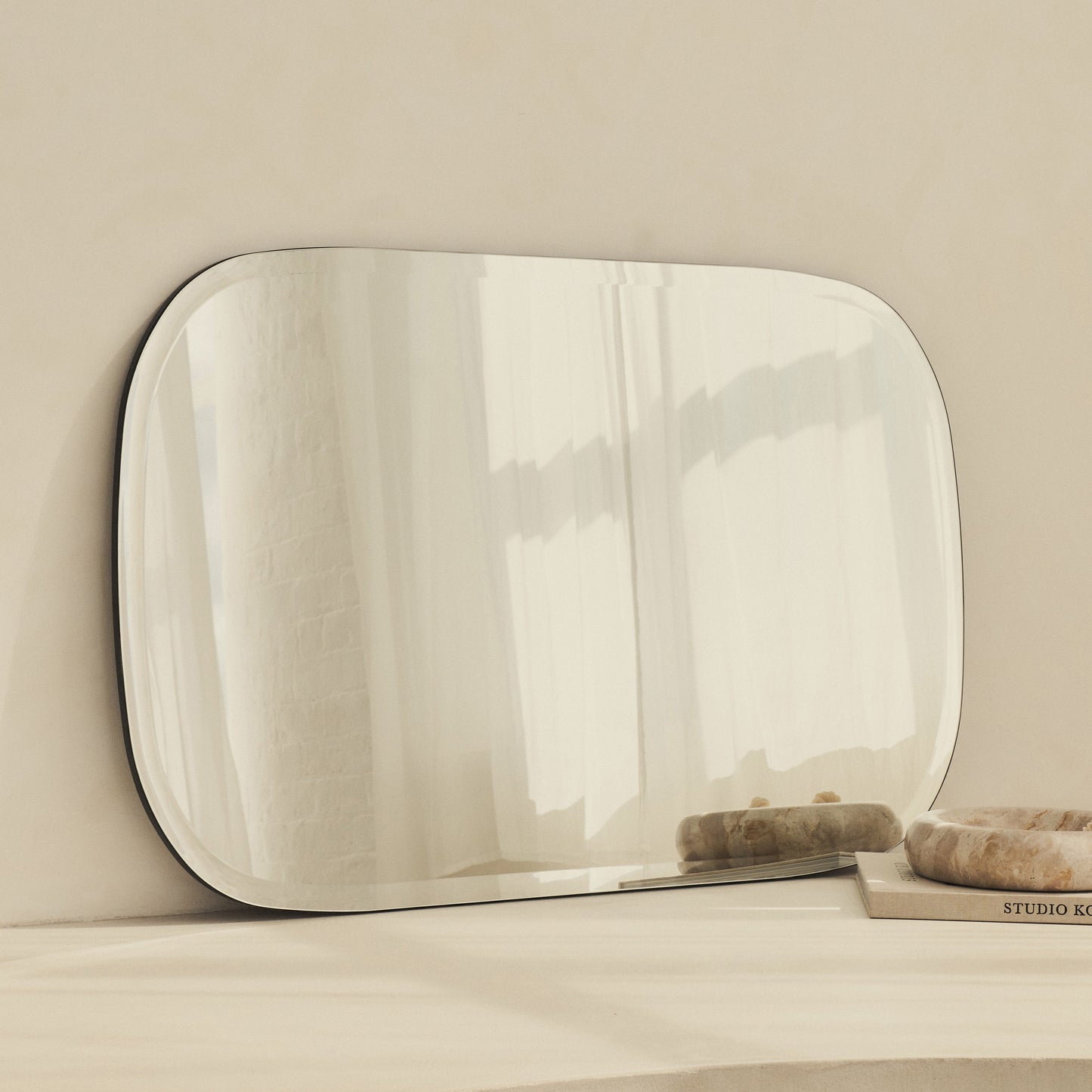 Vienna - Large Frameless Curved Bevelled Mirror 100cm x 65cm